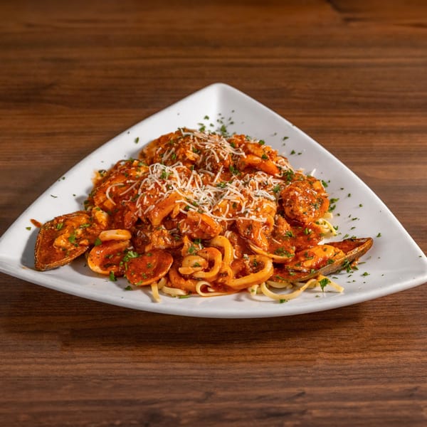 Di Leone's Italian Restaurant's seafood pasta with mussels, calamari, and shrimp in red sauce.