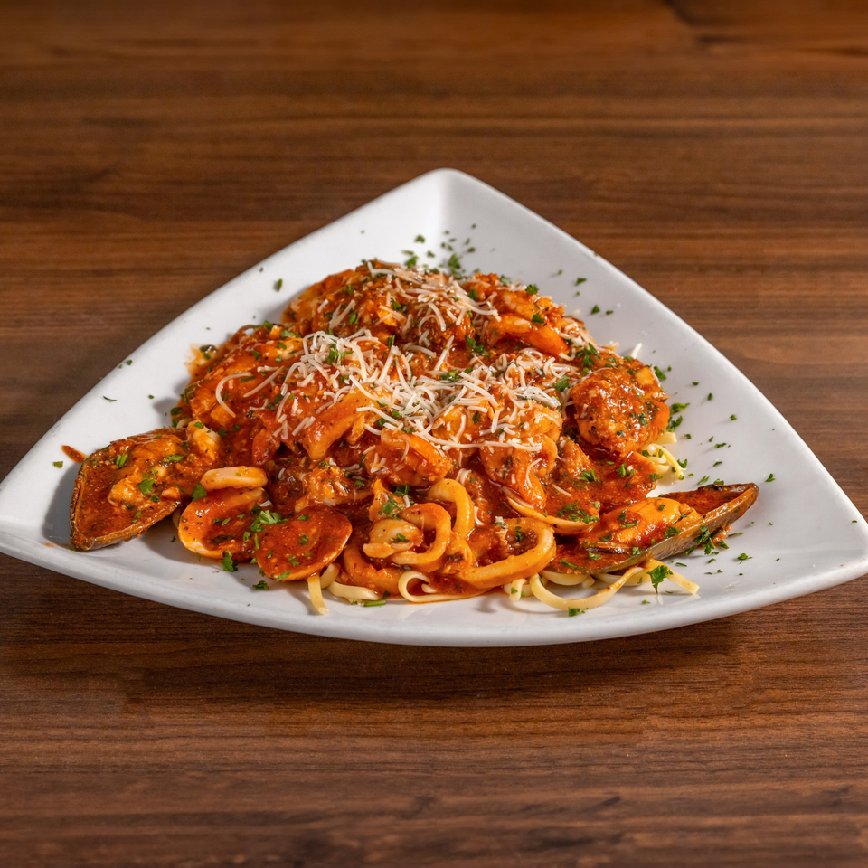 Di Leone's Italian Restaurant's seafood pasta with mussels, calamari, and shrimp in red sauce.